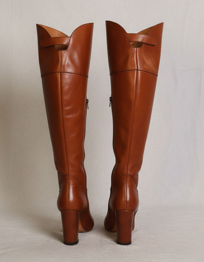 Pair of brown knee-high boots leather boots